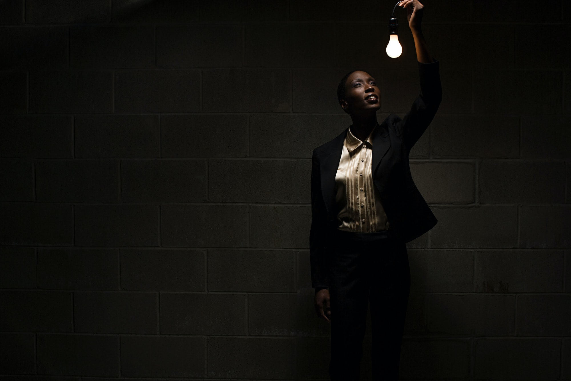 Businesswoman holding lightbulb