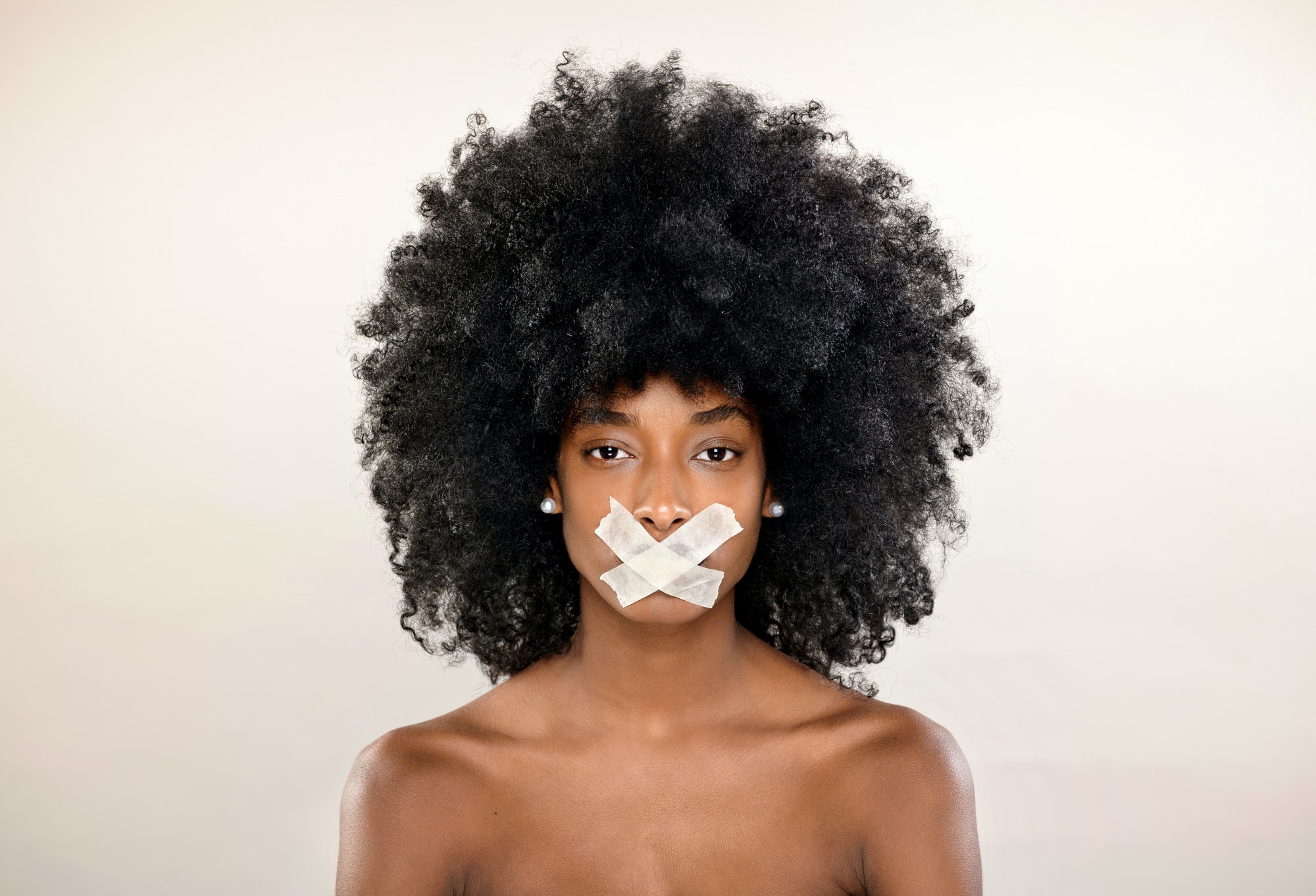 Concept of a censored portrait of a Black woman