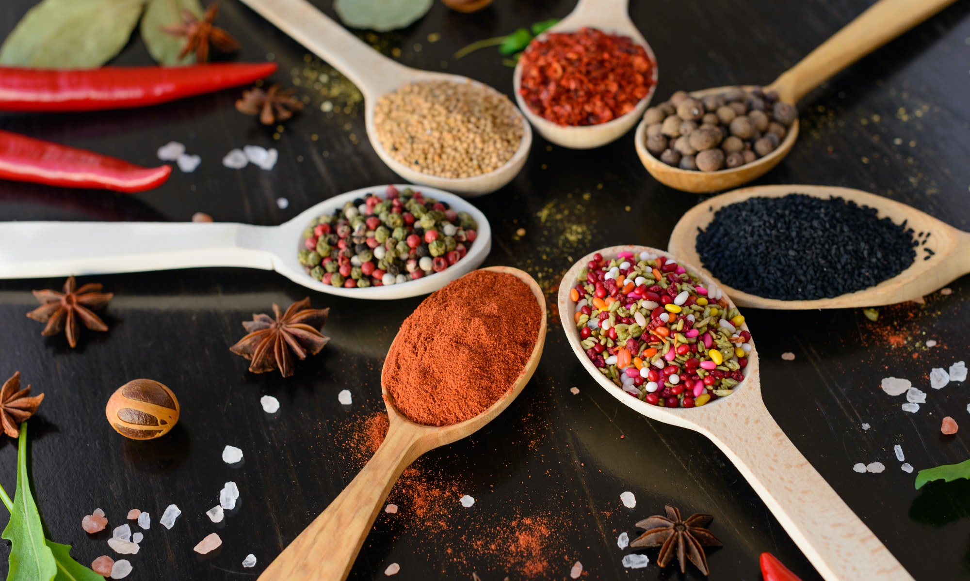 Spices and herbs on old kitchen table